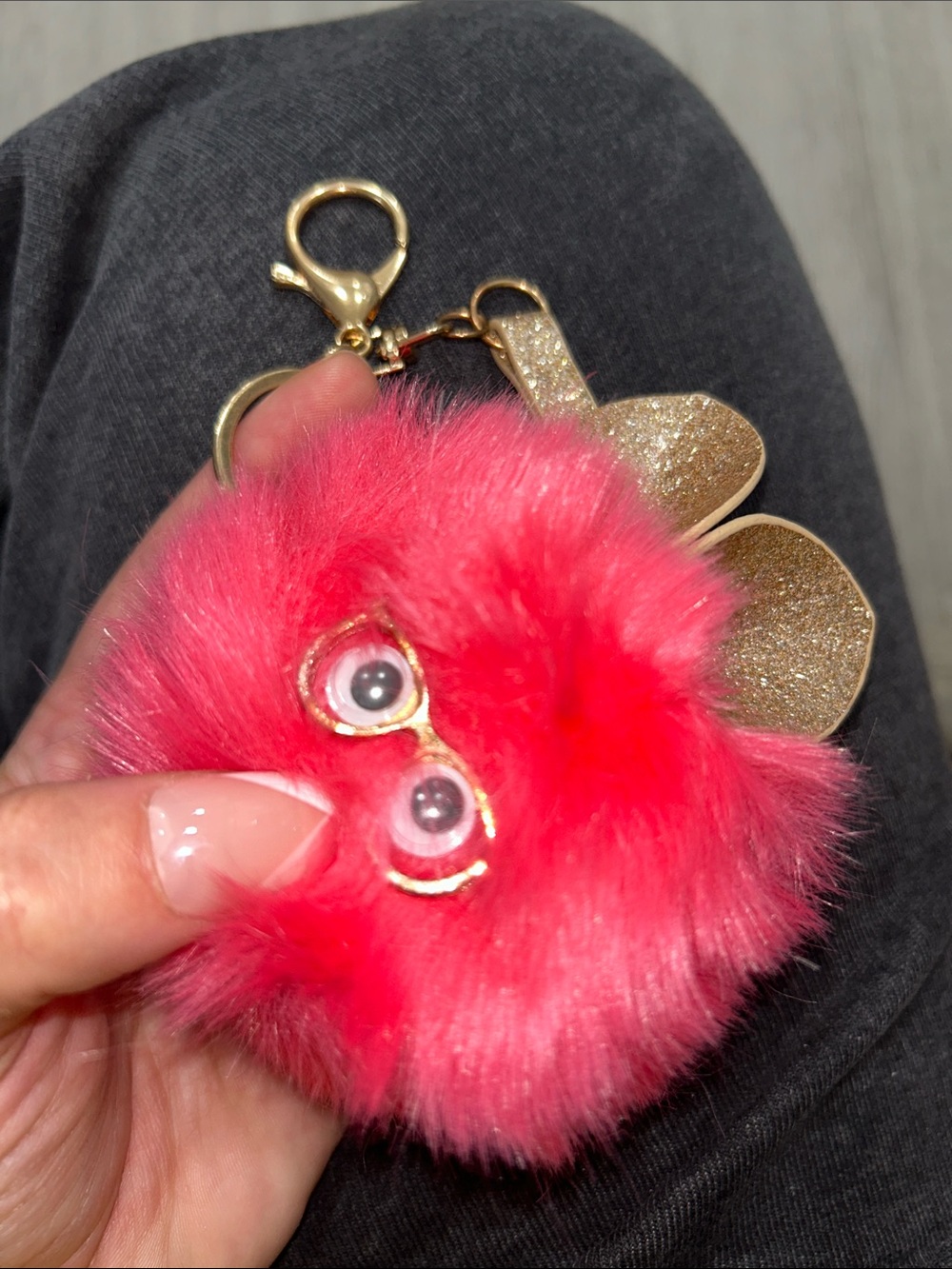 Pink Fuzzy Furby Pom Pom Keychain wearing glasses with Gold Accents